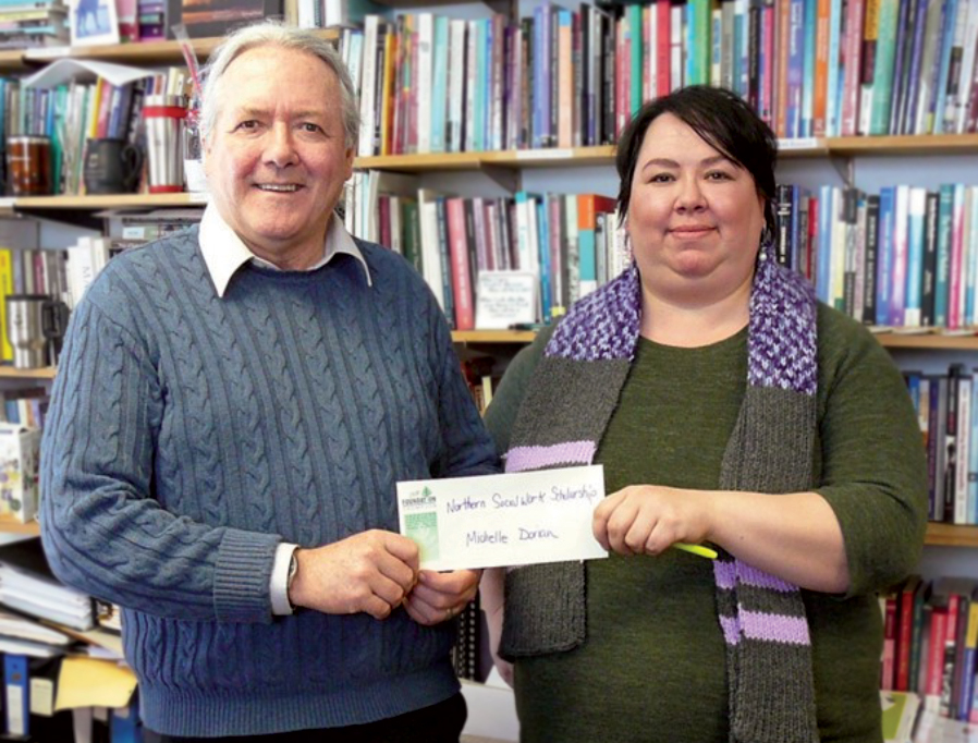 Colin Bonnycastle, Director of the Northern Social Work Program presents Michelle Dorion with scholarship