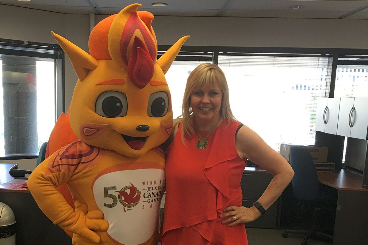 Shawnee Scatliff with Canada Summer Games mascot Niibin.