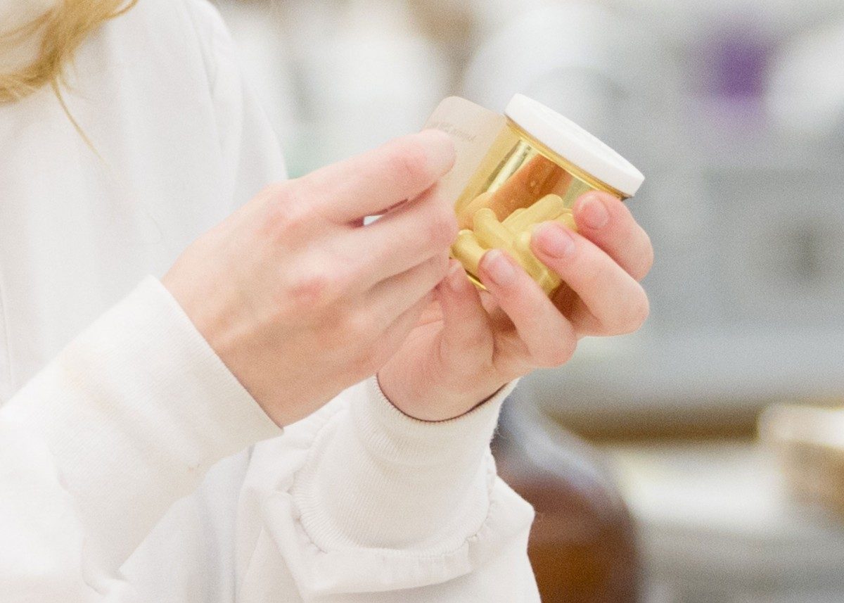 Patient holding a prescription bottle.