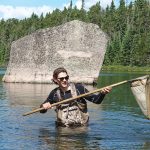 Justin Budyk kick-nets for dragonfly larva and other benthic invertebrates as part of a research project for his co-op program at the IISD-ELA. The insects were to be identified, used to determine isotopic signatures and included in a survey.