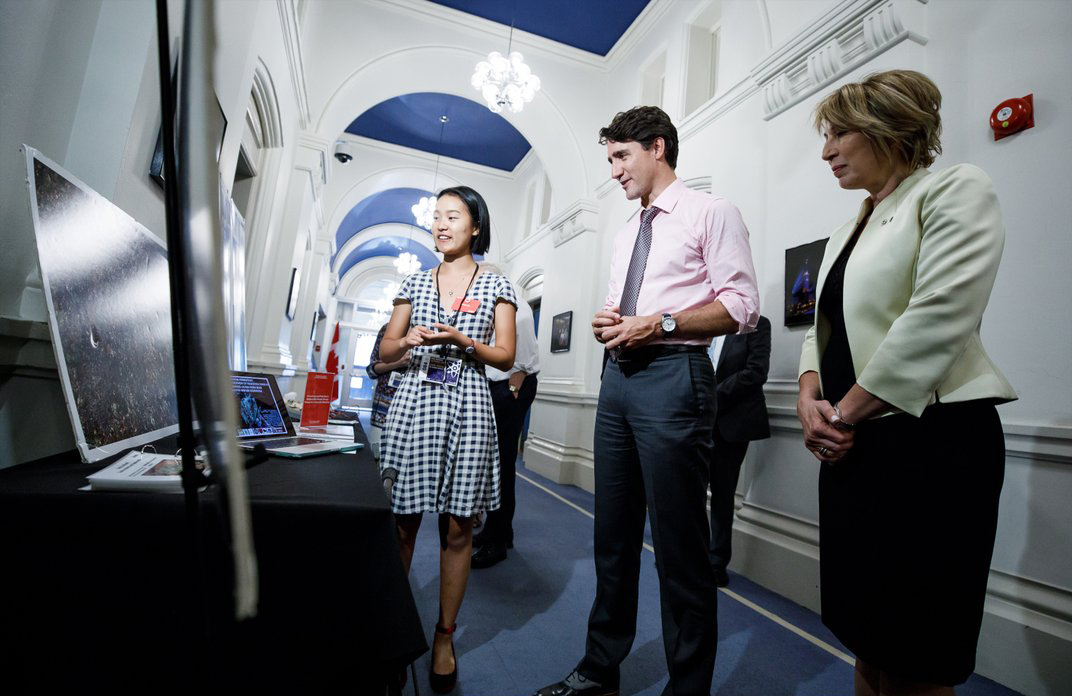 Justin Trudeau views Kelvin High School student Grace Ma's climate change research at the first annual Prime Minister's Science Fair on Sept. 26.