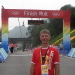 Dr. Glen Bergeron at the finish line for cycling at the 2008 Summer Olympics in Beijing.