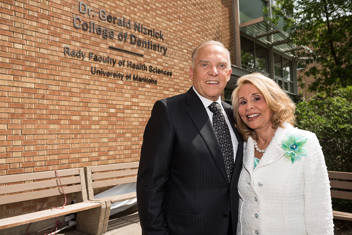 DR. GERALD AND MRS. REESA NIZNICK IN FRONT OF THE NEW SIGN ON MAY 29, 2018.