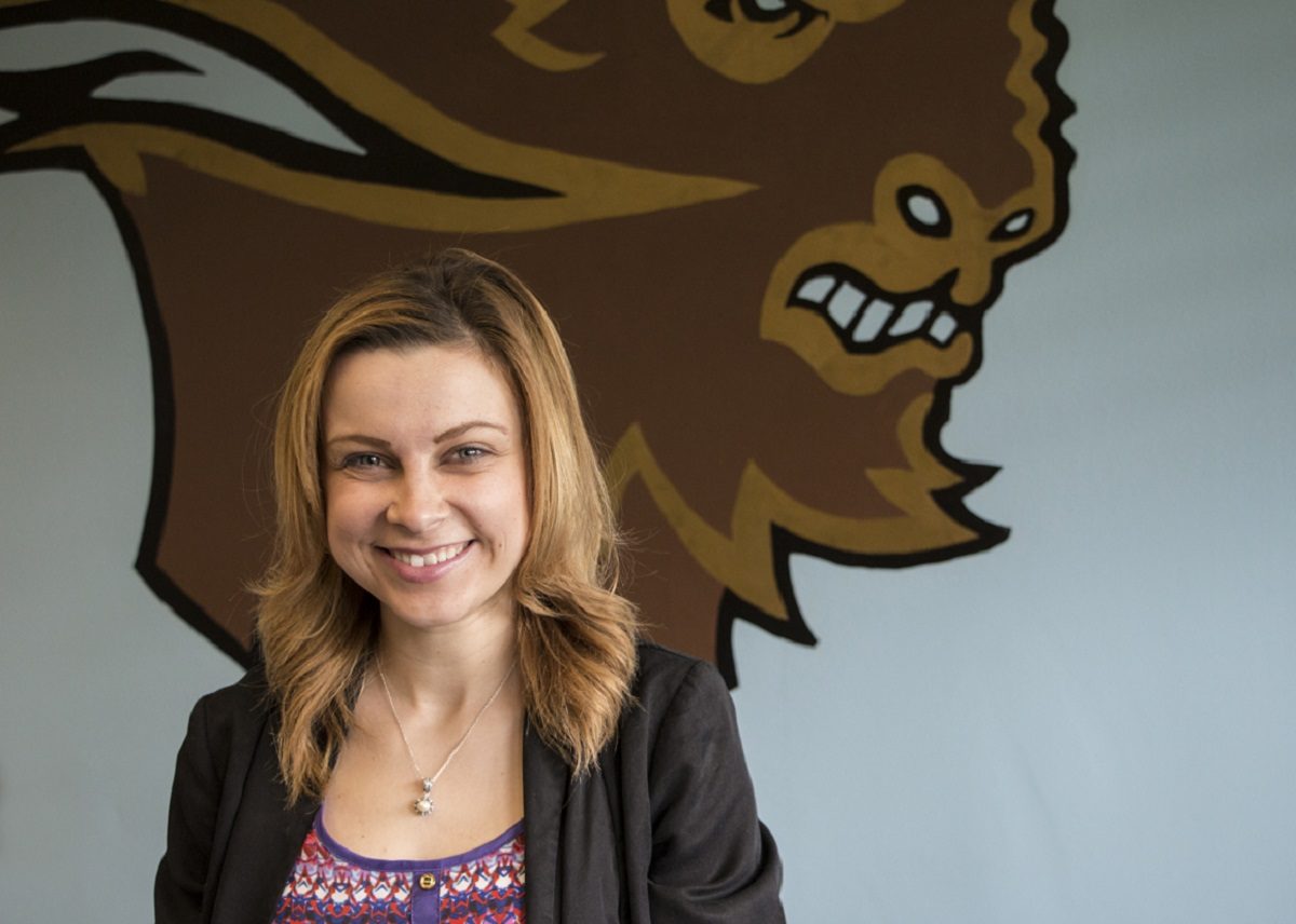 Photo of Courtney Gabrielle in front of Bison wall