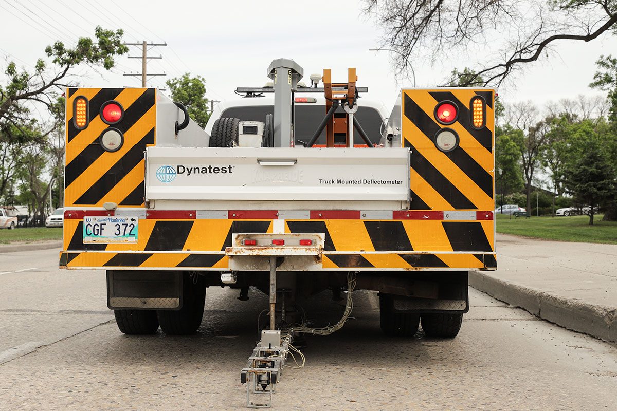 The falling weight deflectometer drops about 180 kilograms (400 pounds) onto the road while sensors gather data to reveal the quality of the pavement below. // PHOTO FROM LEIF NORMAN