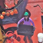 Technician on board the CCGS Amundsen with samples