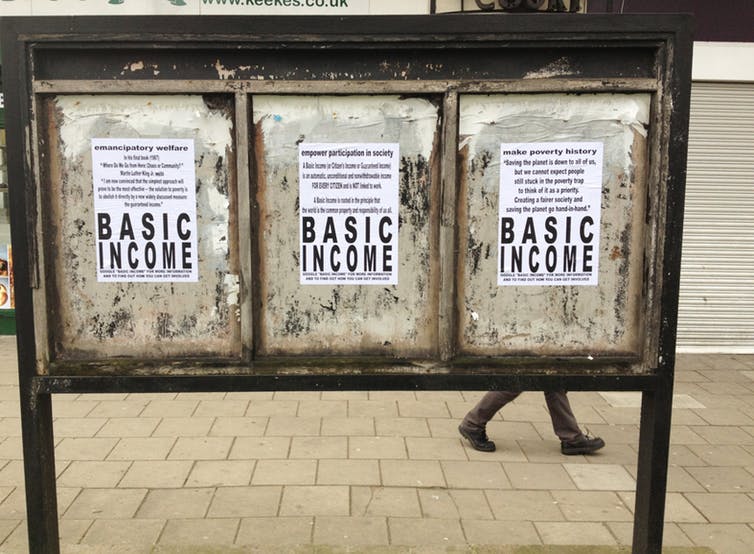 Image of multiple posters promoting a Basic Income government project.