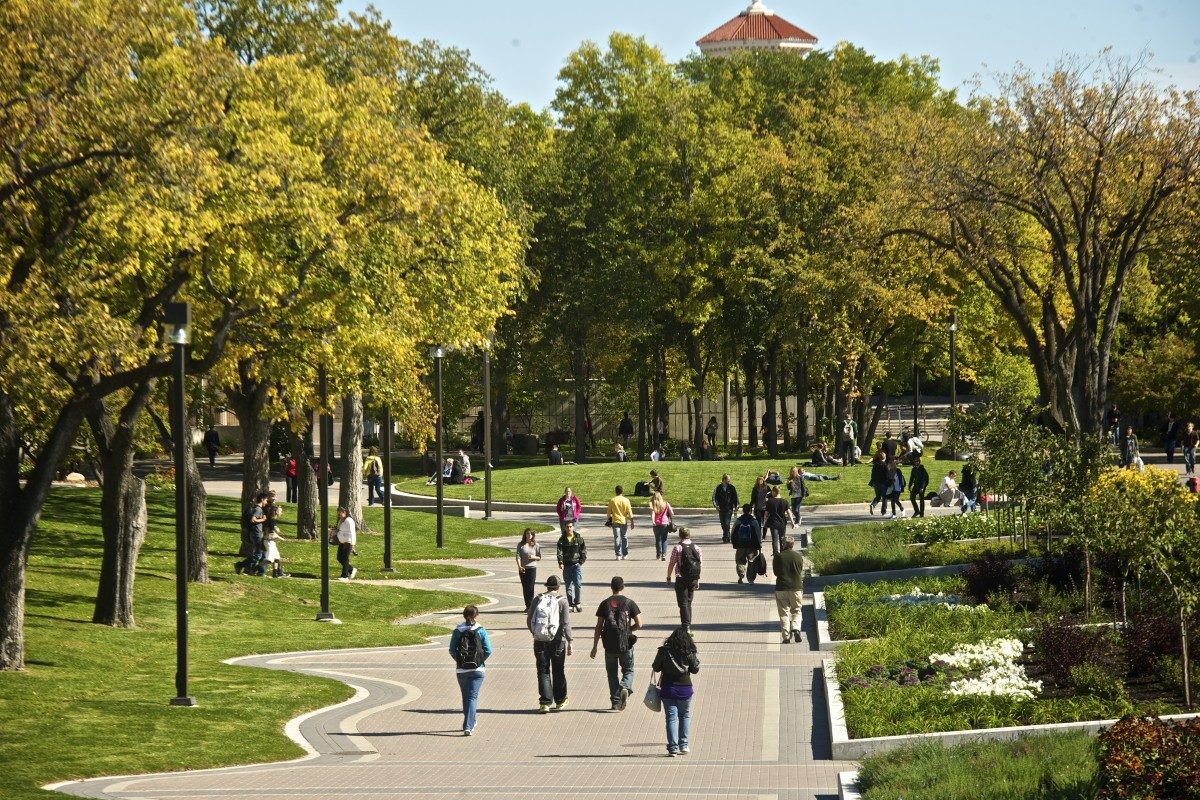 students walking on the pedway on Fort Garry campus in summer time