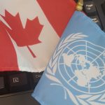 The Canadian and United Nations flags