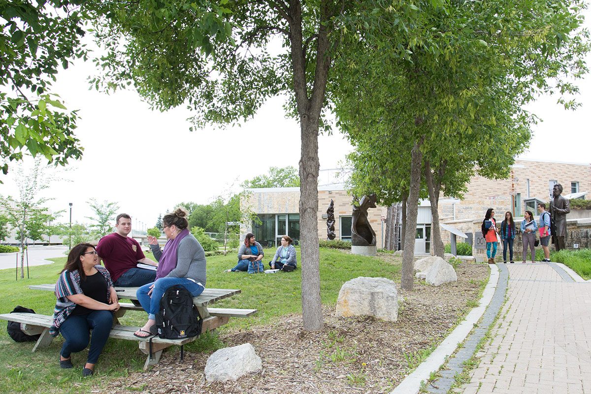 Students outside Migizii Agamik – Bald Eagle Lodge.