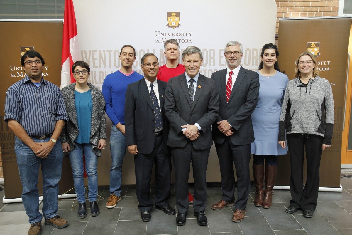 Terry Duguid, MP (Winnipeg South), flanked by Dr. Digvir Jayas (left) and Dr. Marc Fortin (VP of Research Partnerships at NSERC), with successful grant applicants