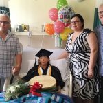 Edith Linklater celebrates graduation in a hospital bed