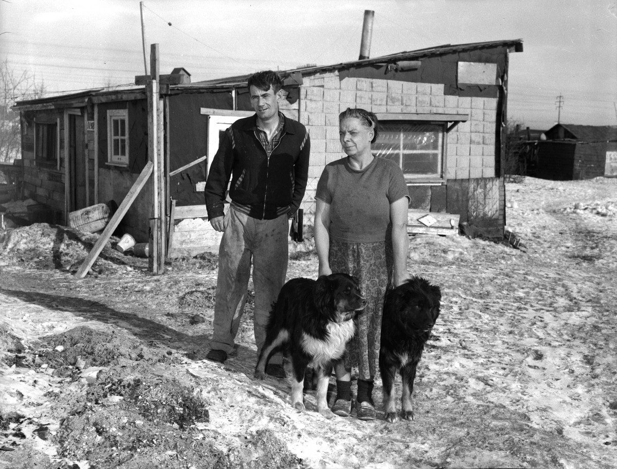 Ernest and Elizabeth Stock stand outside their Rooster Town house in a 1959 Free Press photo