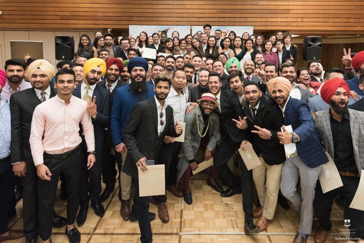 International students cheer as they celebrate the completion of their studies.