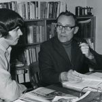 A photo of agriculture student John Enns with Eugene Lange in Lange's office.