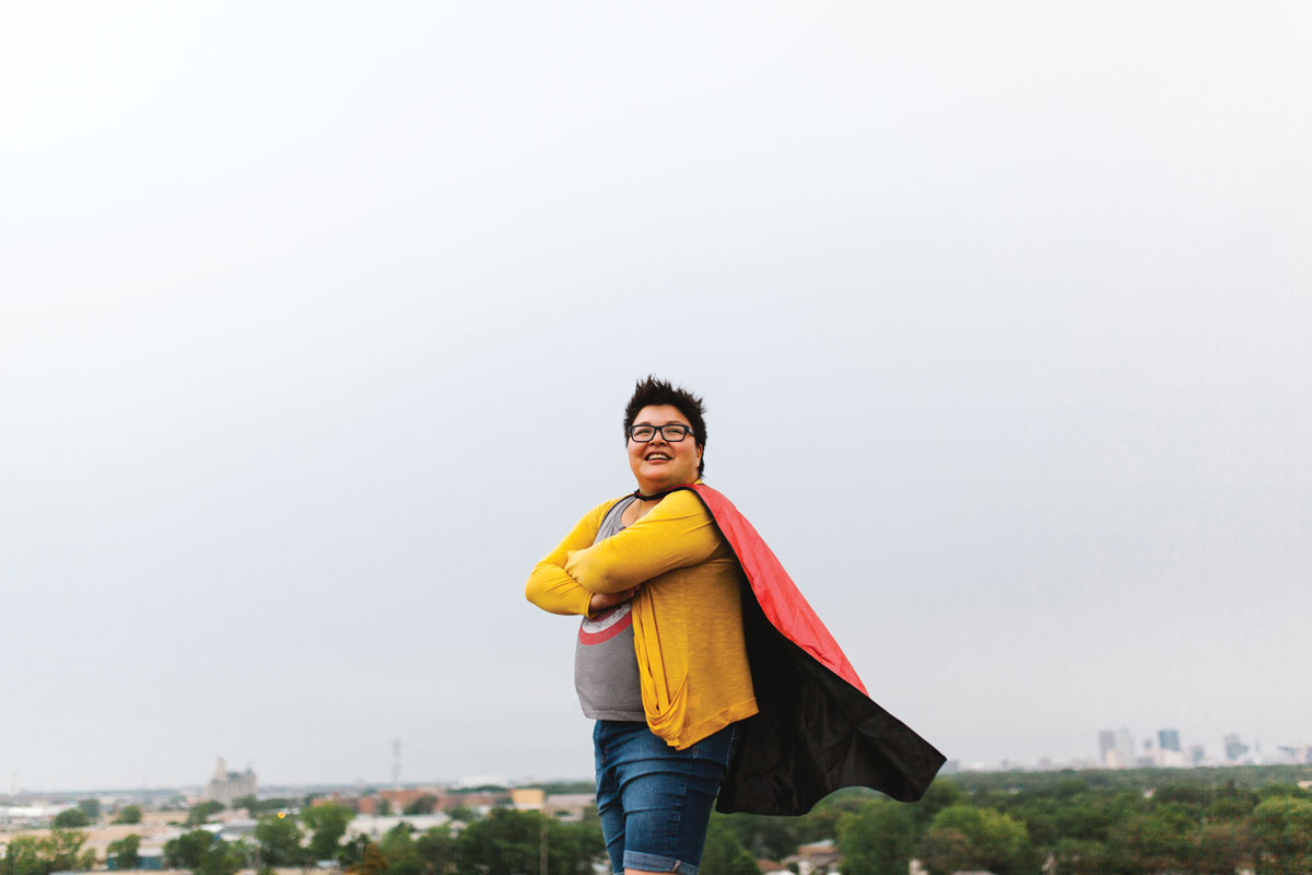 Sonya Ballantyne stands wearing a cape