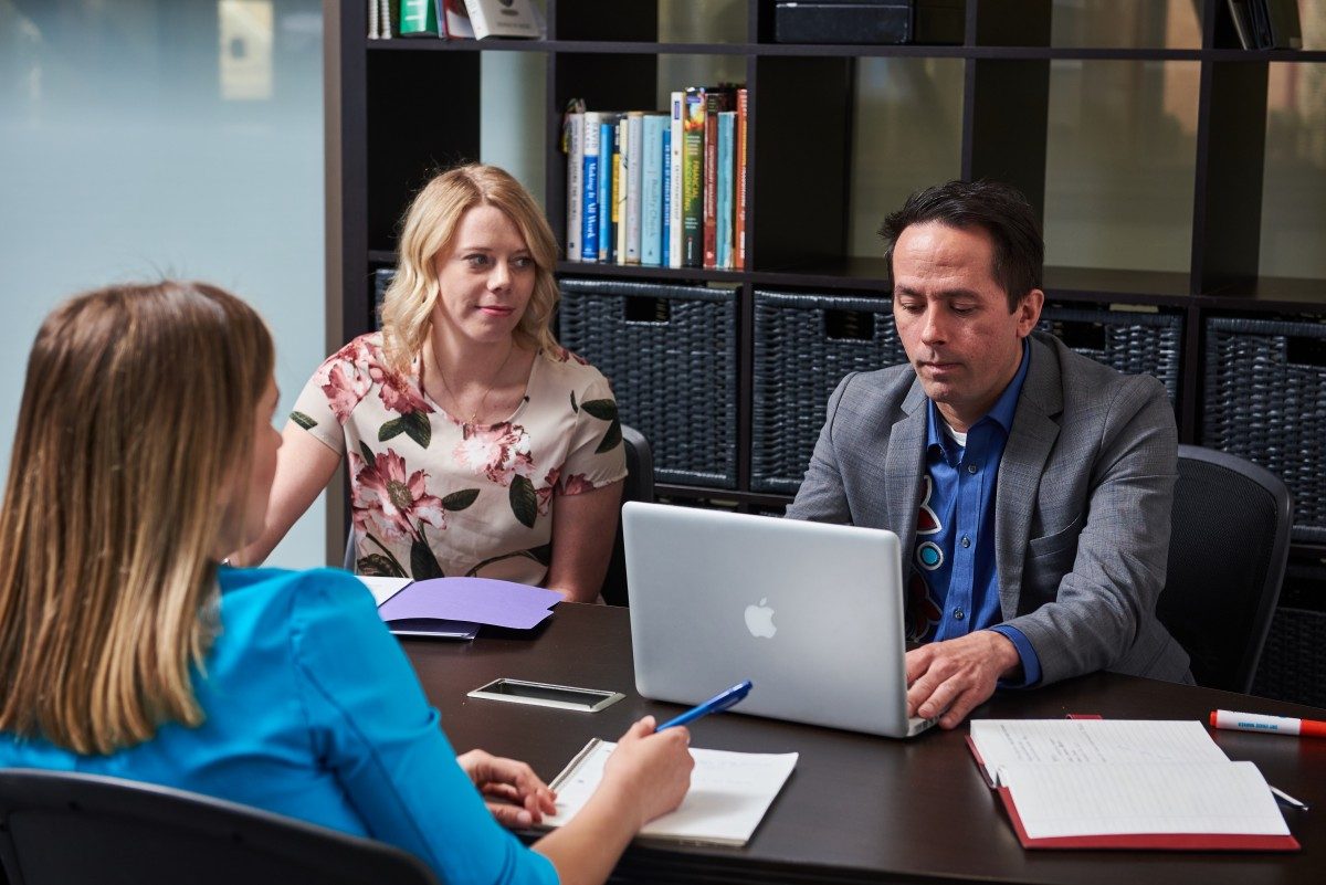 Staff members at computer