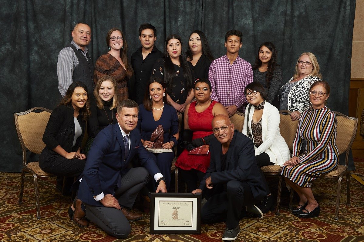 Christa Bruneau Guenther (middle row, third from the left) poses with VIBE Award and Feast Café Bistro staff.