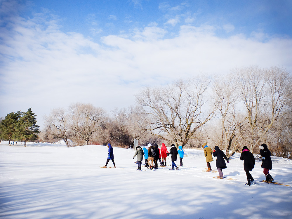 People snowshoeing