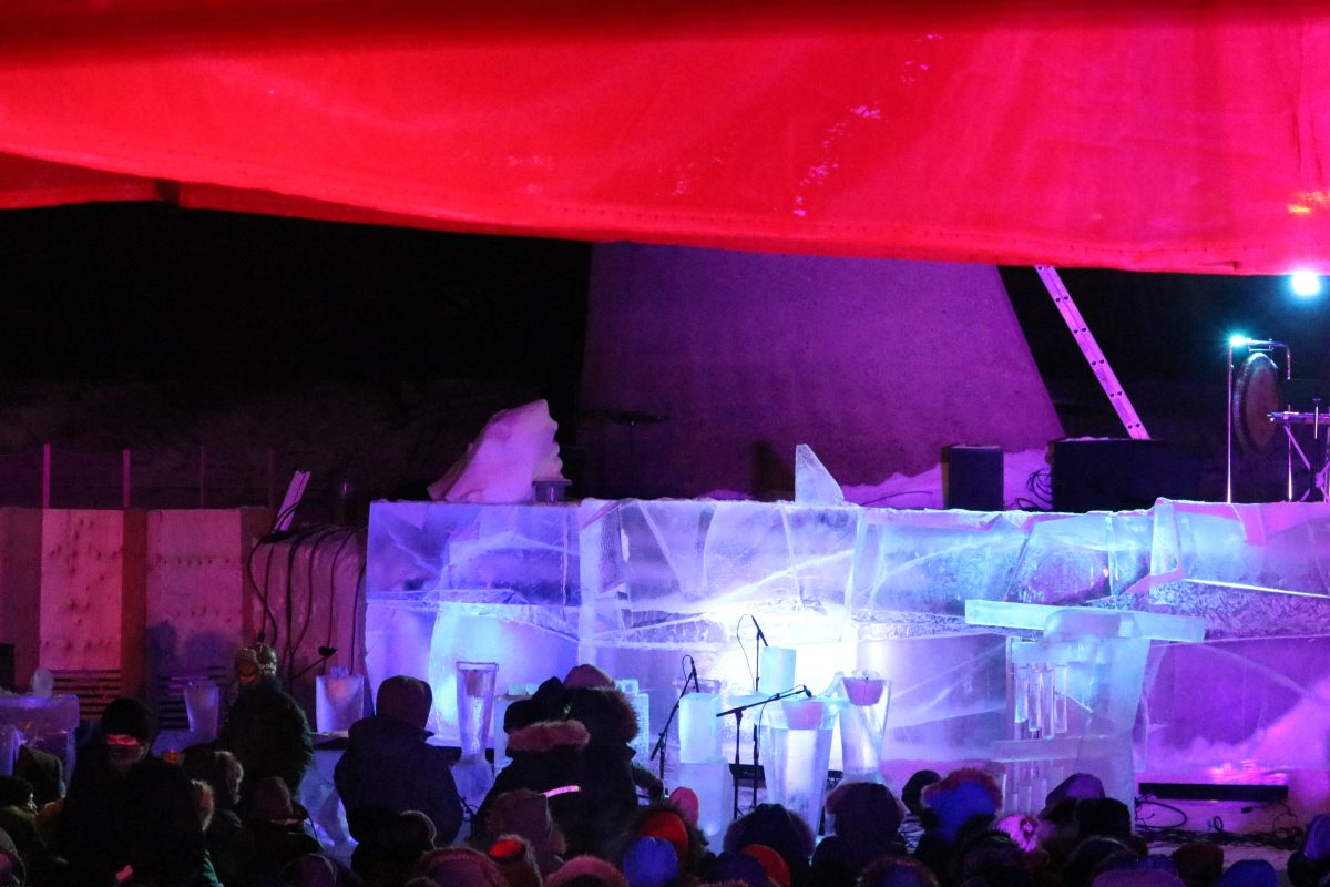 Audience admires illuminated ice instruments