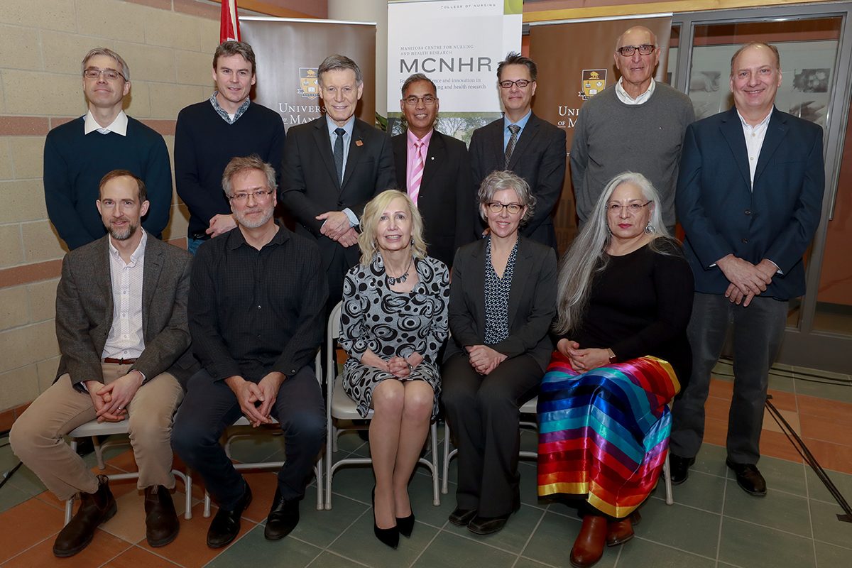 Front row (l-r): Recipients Aaron Marshall, Michael Czubryt, Roberta Woodgate (CRC), Kellie Thiessen and Elder Katherine Whitecloud (Assembly of First Nations) (back row, l-r): Recipients Frank Schweizer and Brian Mark, MP Terry Duguid, UM VP Research & International Digvir Jayas, and recipients Ian Dixon, Leslie Roos and Benedict Albensi.