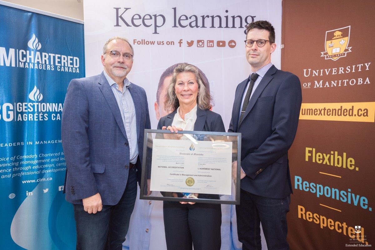Steve Lupky, Chair, Manitoba Chapter of CIM/Chartered Managers Canada presents Sheila Lapinski, Program Coordinator, and Paul Jenkins, Manager, Delivery, Extended Education with CIMA's CIM accreditation.