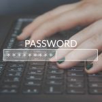 hands at keyboard typing with a password login image laid over top
