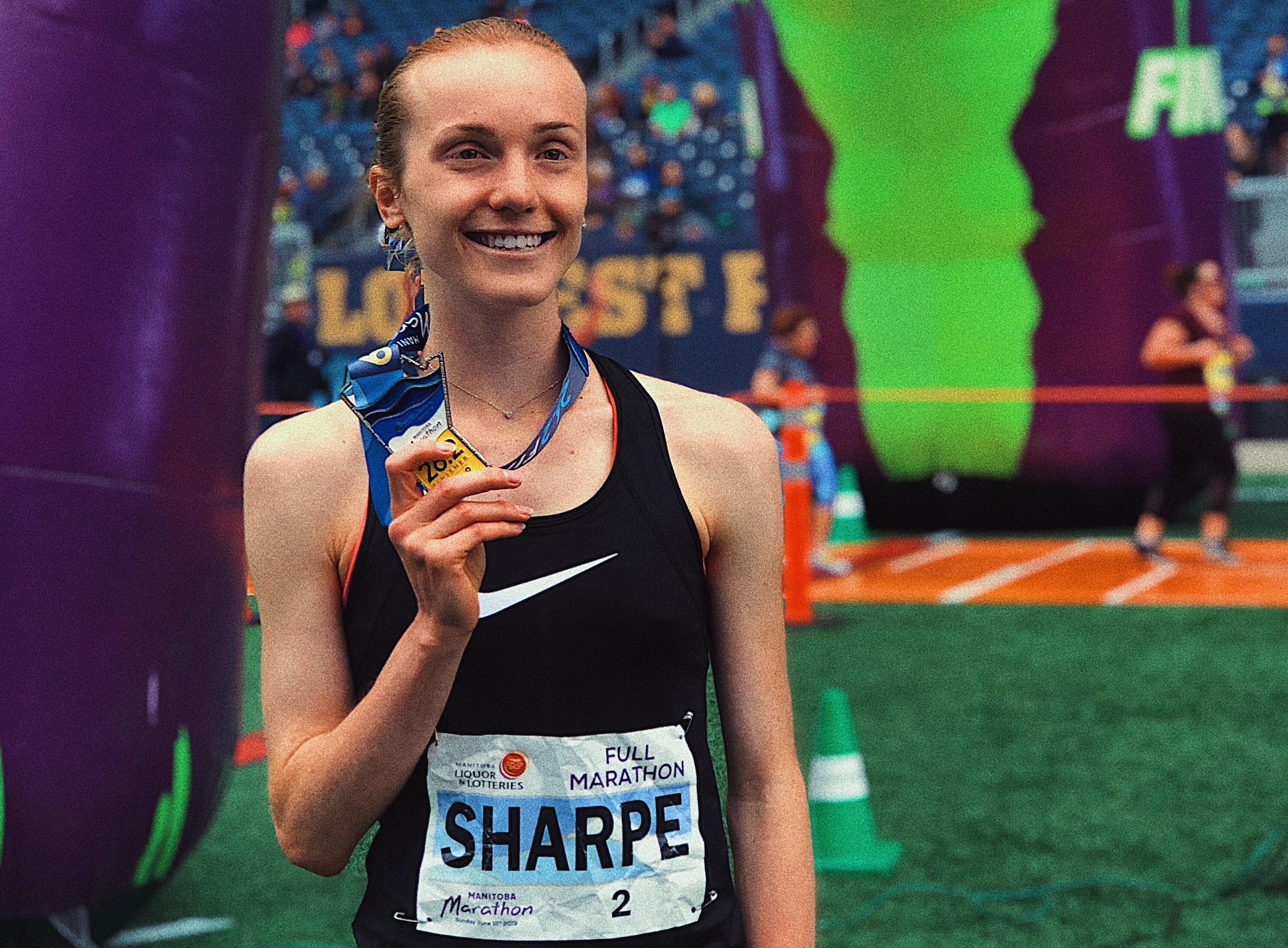 Selene Sharpe with 2019 Manitoba Marathon Medal