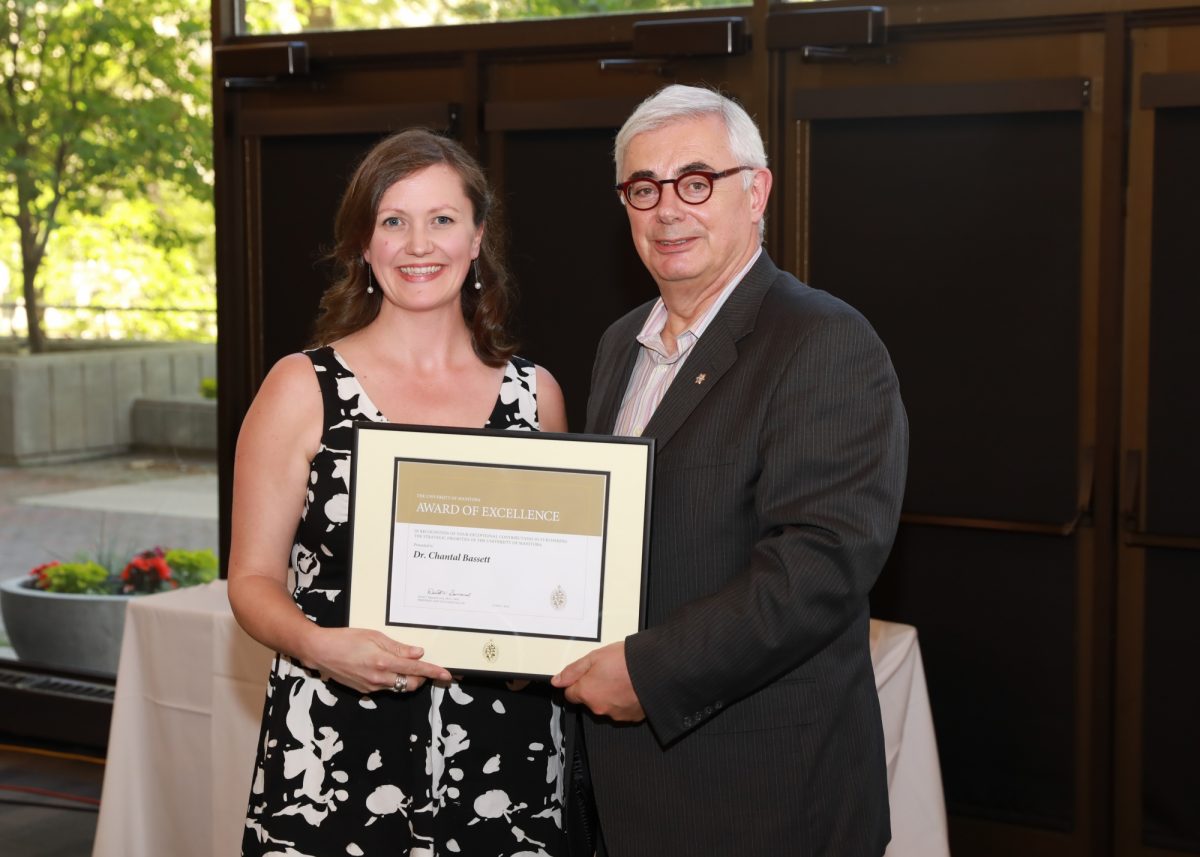 Chantal Bassett receives award from President Barnard