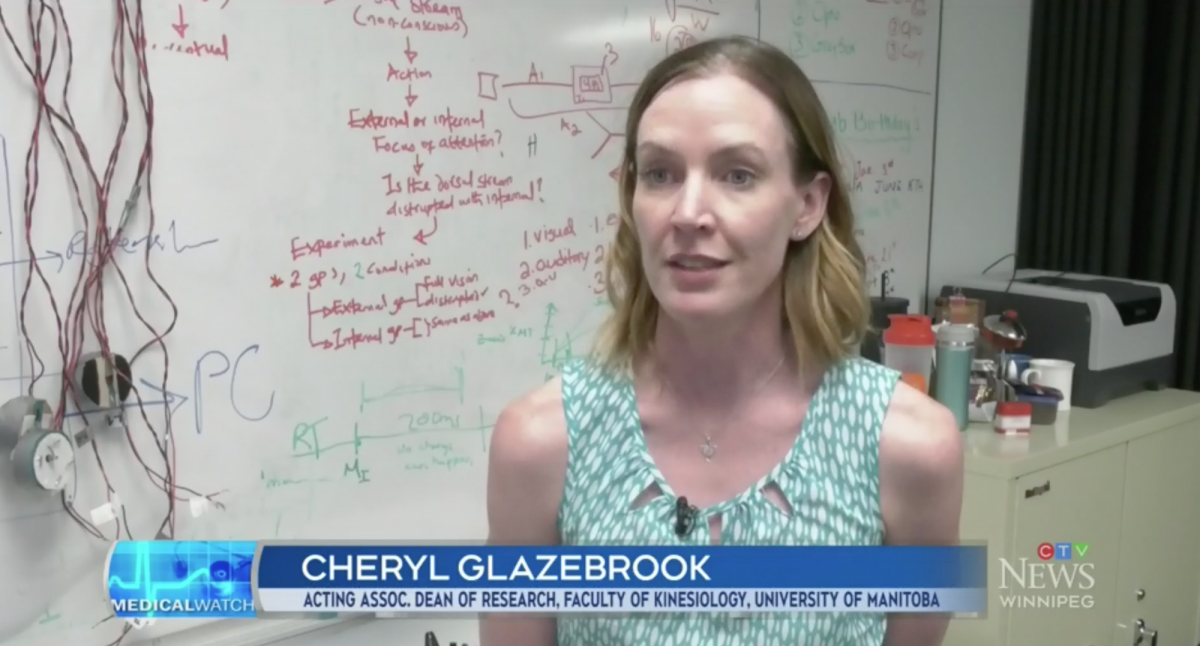 A still photo of Cheryl Glazebrook speaking with CTV Winnipeg in her lab at the U of M.