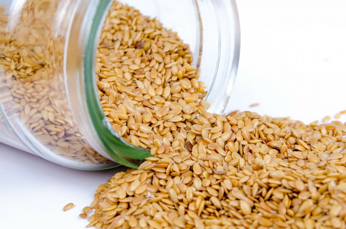 Sesame seeds spilling from a jar