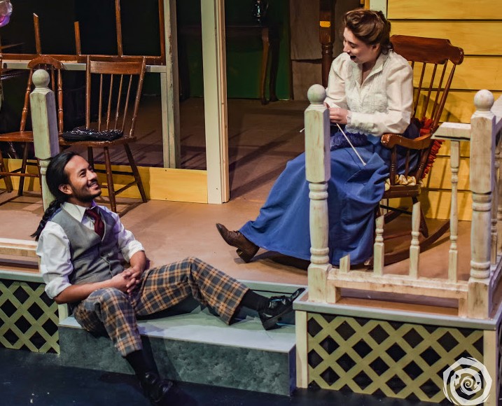 Two actors sitting on a porch during a stage production of Look Homeward, Angel