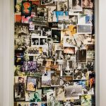 A door completely covered in a massive collage of photographs from different eras
