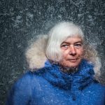 Dorthe Jensen in a blue parka, with ice surrounding her face.