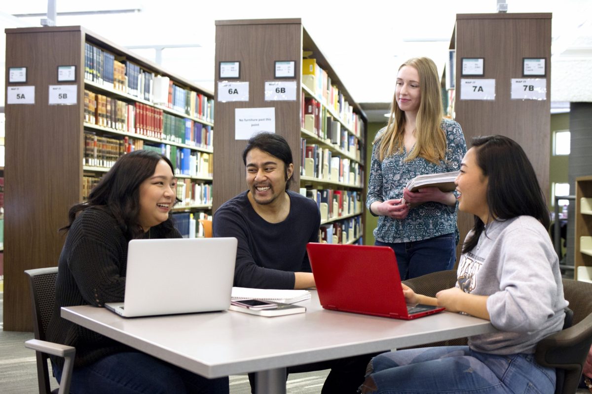 Students in library with laptops