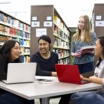 Students in library with laptops