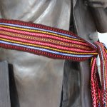 The Metis sash on the statue of Louis Riel at UM