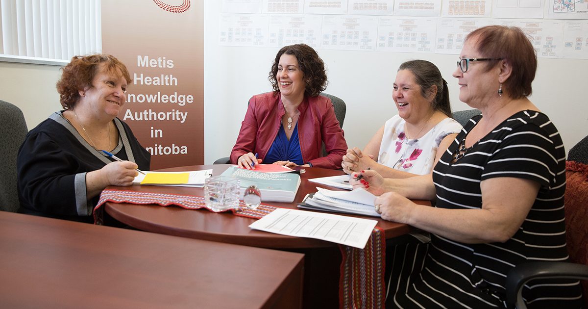 Michelle Driedger (community health sciences) with research partners at Manitoba Metis Federation, Georgina Liberty, Sheila Carter and Julianne Sanguins.