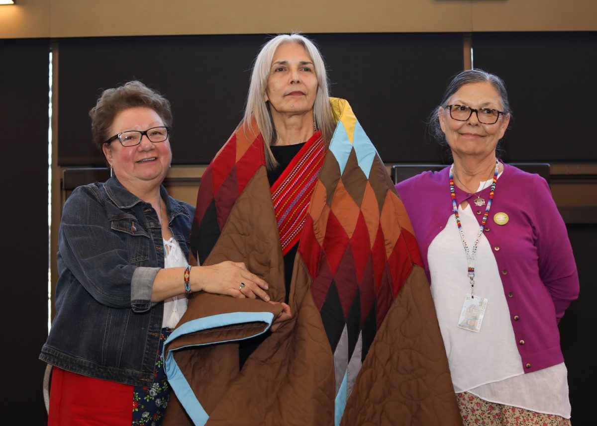 Brenda Lafreniere receives a star blanket at the Indigenous Awards of Excellence.