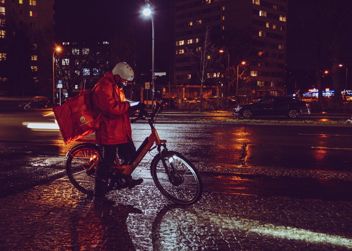 Bicycle delivery person on city street