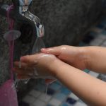 A child washes hands