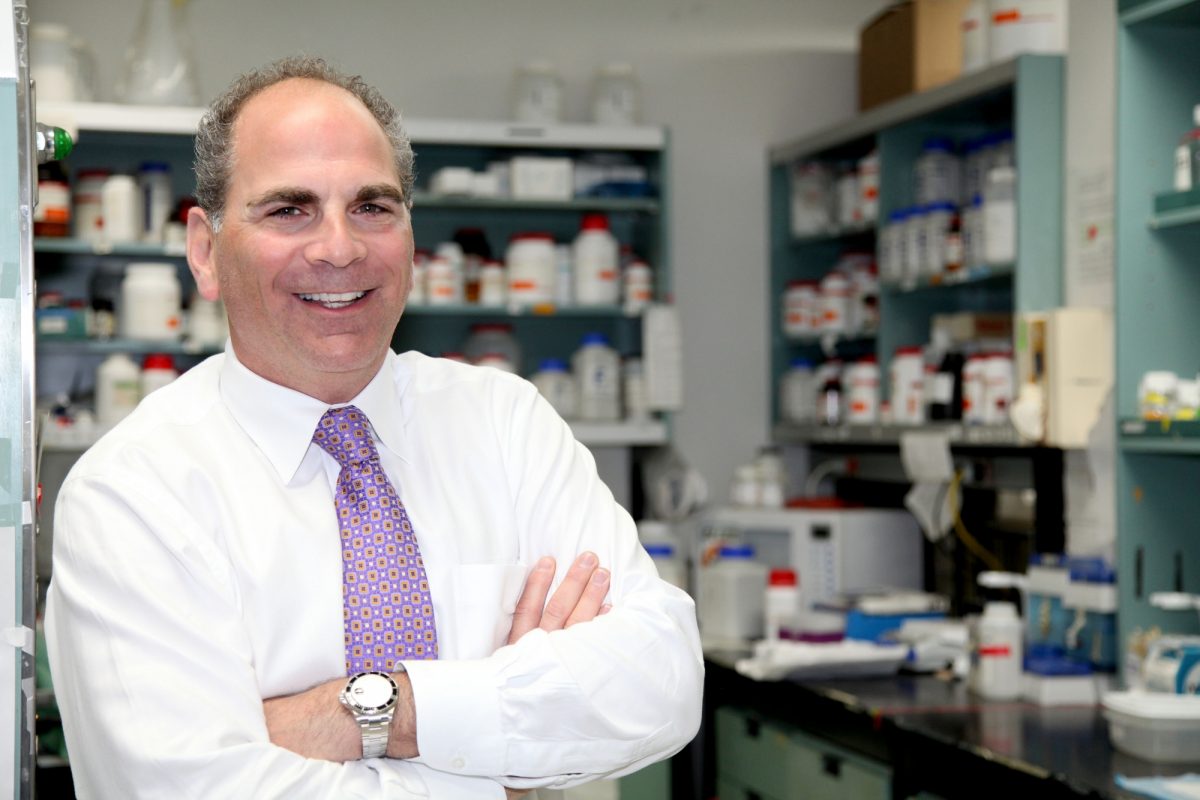 Dr. Lorrie Kirshenbaum in his research lab