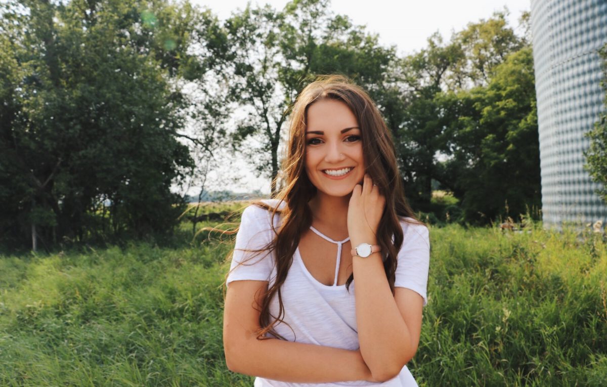 Chauntel Dyck standing in a field.