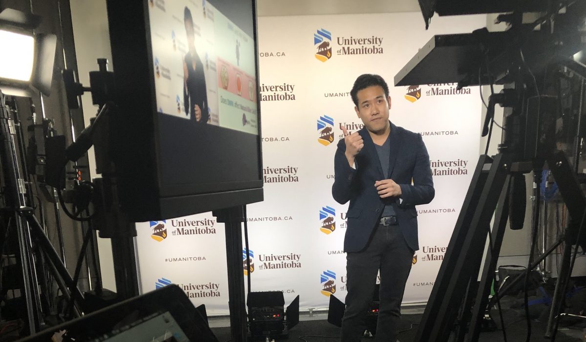 Three Minute Thesis presenter in front of camera