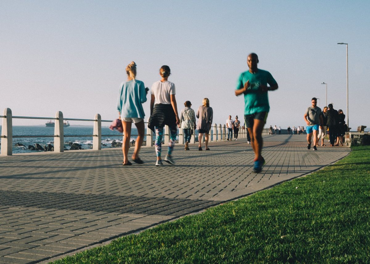 People jogging and walking on a path.