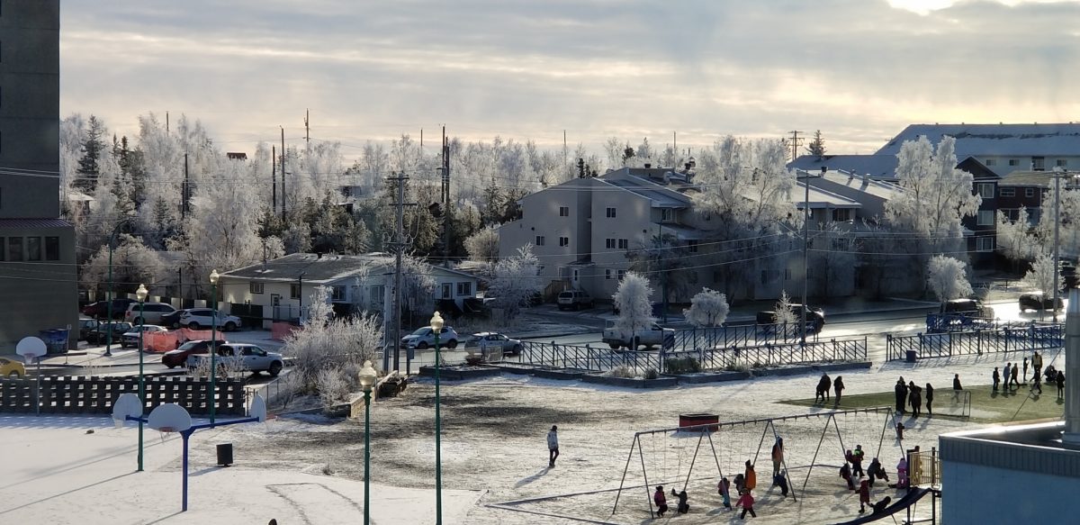 playgorund, town houses and parking lot in the winter