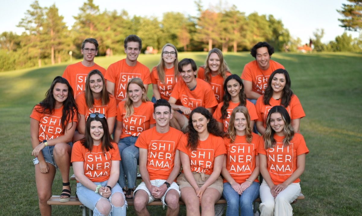 Group of students in orange shirts