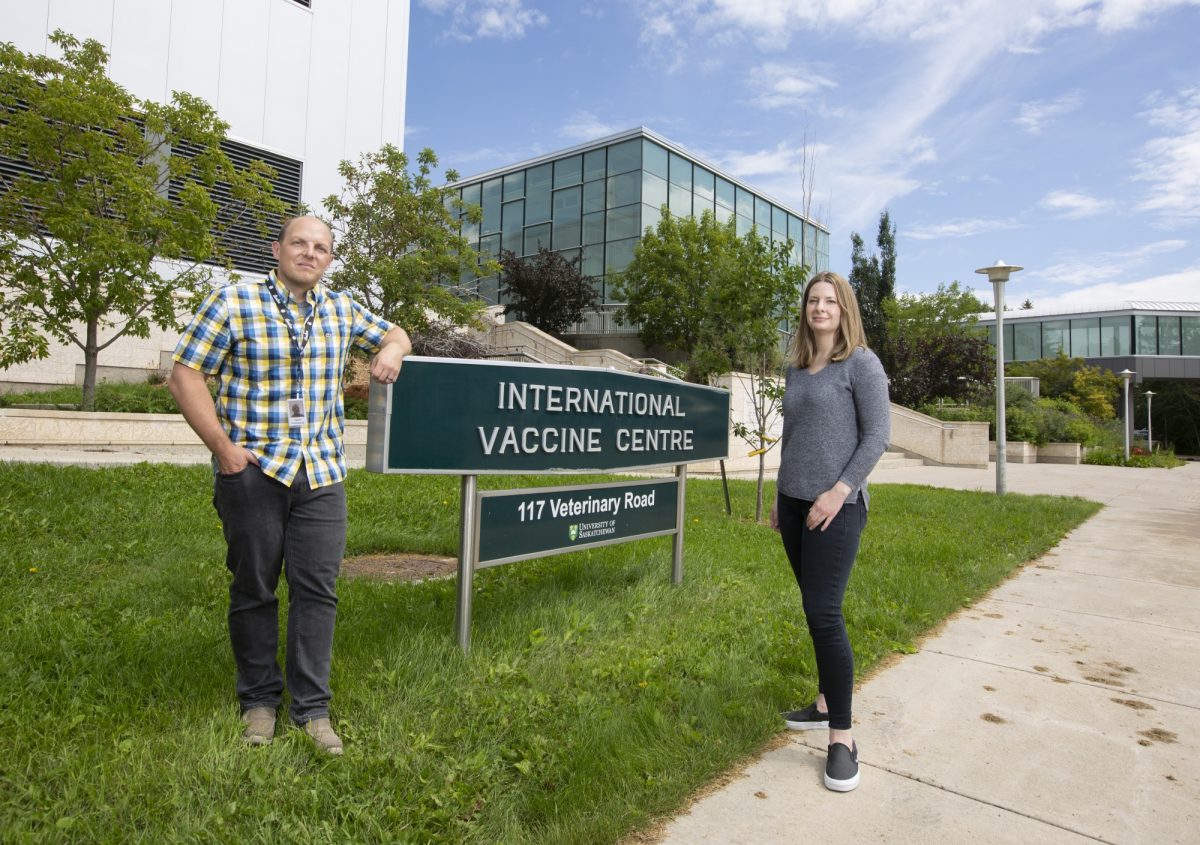 Jason Kindrachuk (University of Manitoba) and Alyson Kelvin (Dalhousie University) stand in front of the Vaccine and Infectious Disease Organization-International Vaccine Centre | Photo: David Stobbe/University of Saskatchewan