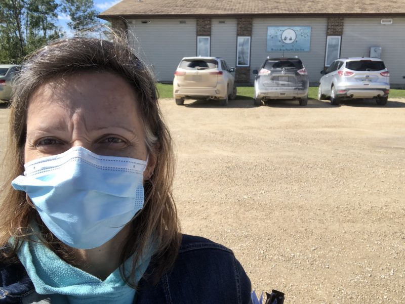 Andrea Simser wears a mask for fieldwork at Lake Manitoba First Nation.