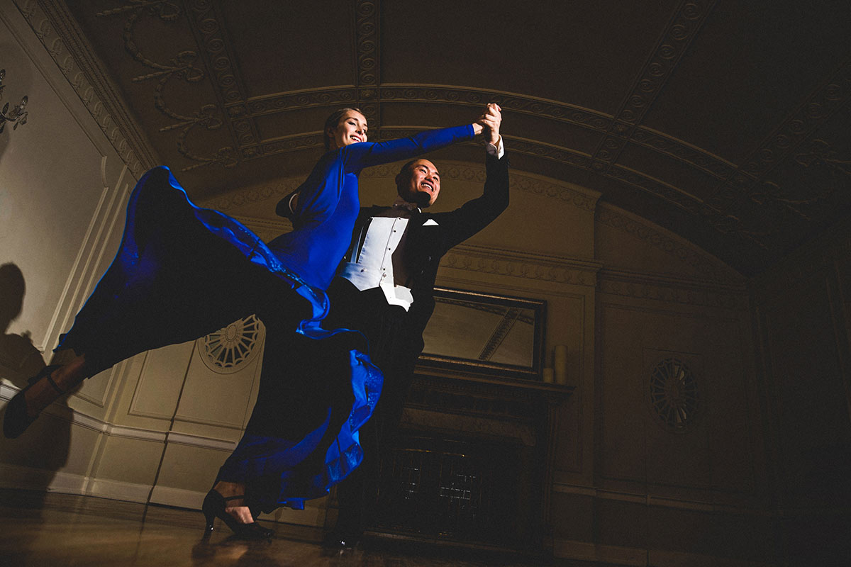 Horace Luong and Sophie Sickert perform a ballroom dance in formal clothing.